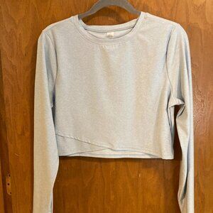 Light blue "go dry" cropped long sleeve top.